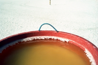 Salar de Uyuni, Potosi' Province, Bolivia - Jul. 30, 2010. A bucket with brine to extract lithium. (Photo by Alessando Vecchi)